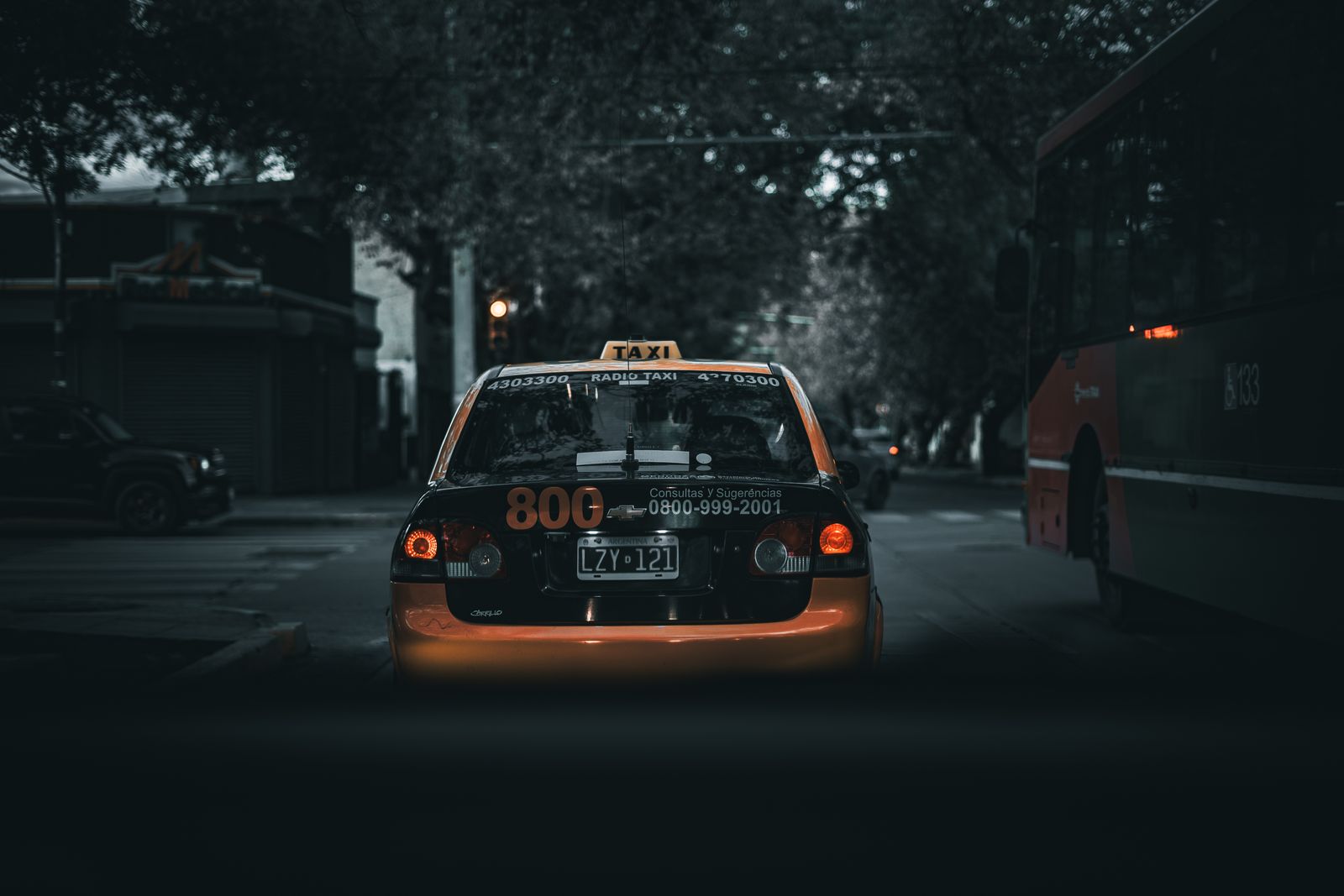 Black taxi on a Barcelona street at dusk